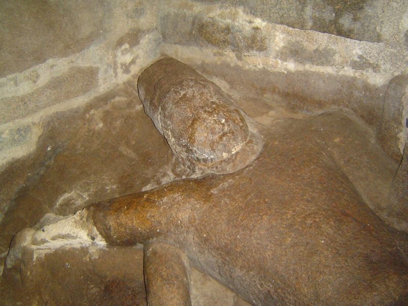 Unlike the rest of the temple, he's been carved from the bedrock.