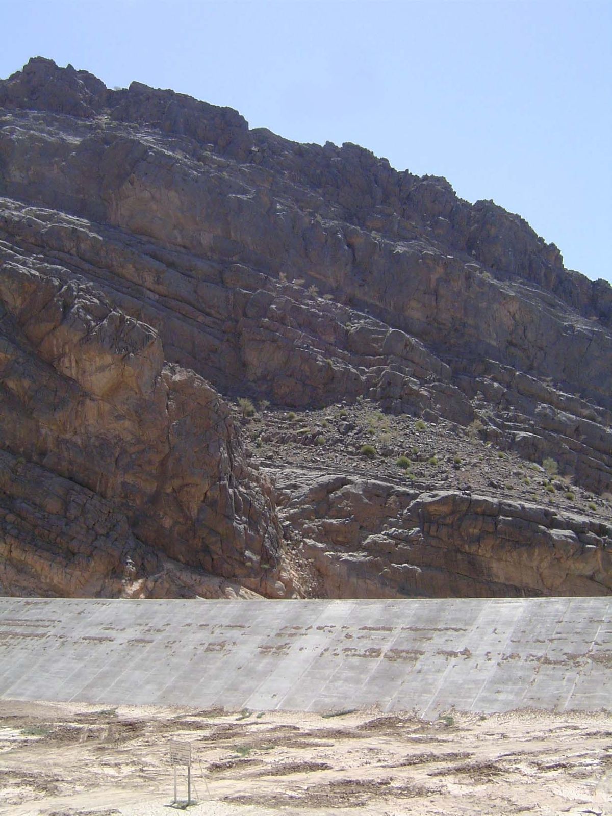 A recent 1989 dam. This is the upstream face, dry as a bone but intended only to slow occasional floodwaters and in that way increase aquife