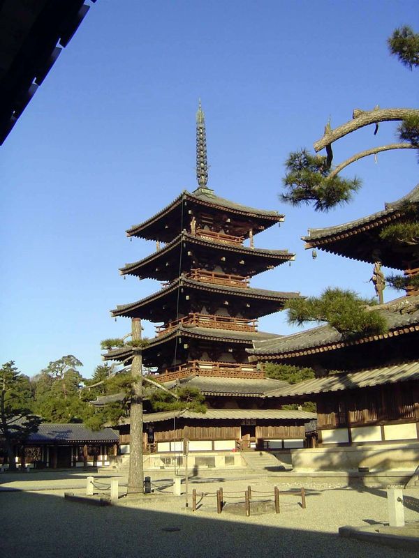 Next to the kondo is the Goju-no-To or pagoda, with its original timbers from 607. Its broad eaves, including an additional mokoshi at the b