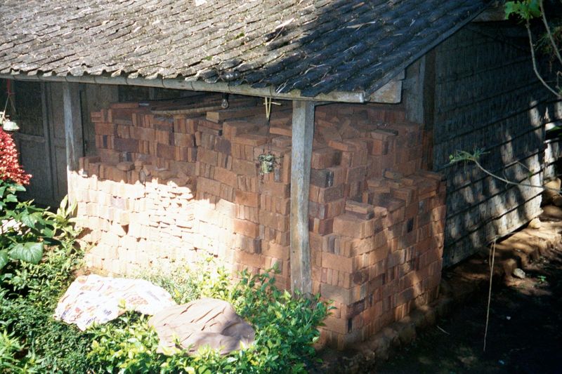 They're heading to the top, where somebody has manhandled a small mountain of bricks all the way up to a village.