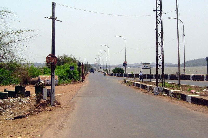 Looking west over the causeway and toward the sea. In the distance, a new bridge crosses the Mandovi River.