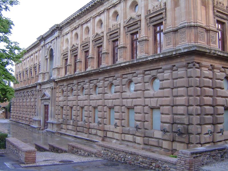 The palace of Charles V was begun in 1527 and located on the site of Nazrid palaces cleared for the purpose. The palace was paid for by taxe