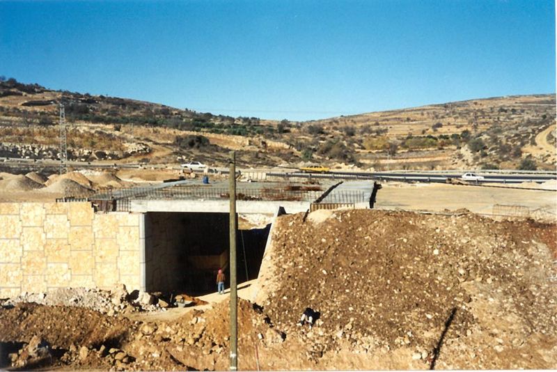 Near Ephrata, a Palestinian road is kept separate from the main highway being built for Israelis travelling to Jerusalem.