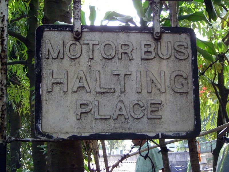 Kandyans took to the bus, as well as the train. The irony of this sign—nearly obscured by leaves—is that buses abound in Sri Lanka today, bu