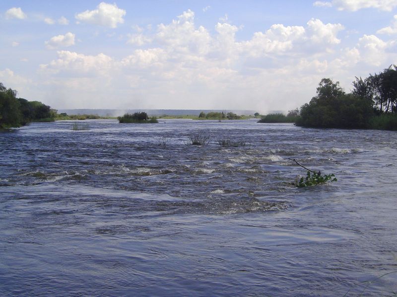 And here's the Zambezi, with an island on the right and some of the "smoke that thunders" in the distance.