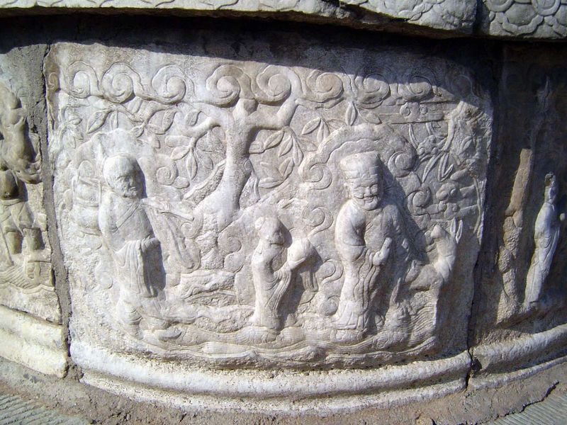 A common theme on these tombs is a eunuch serving his emperor.
