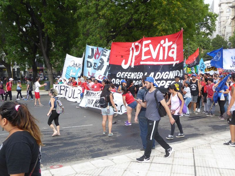 Meanwhile, a protest march comes up the Avenida. "JP" is the Juventud Peronista, or Peronist Youth movement.