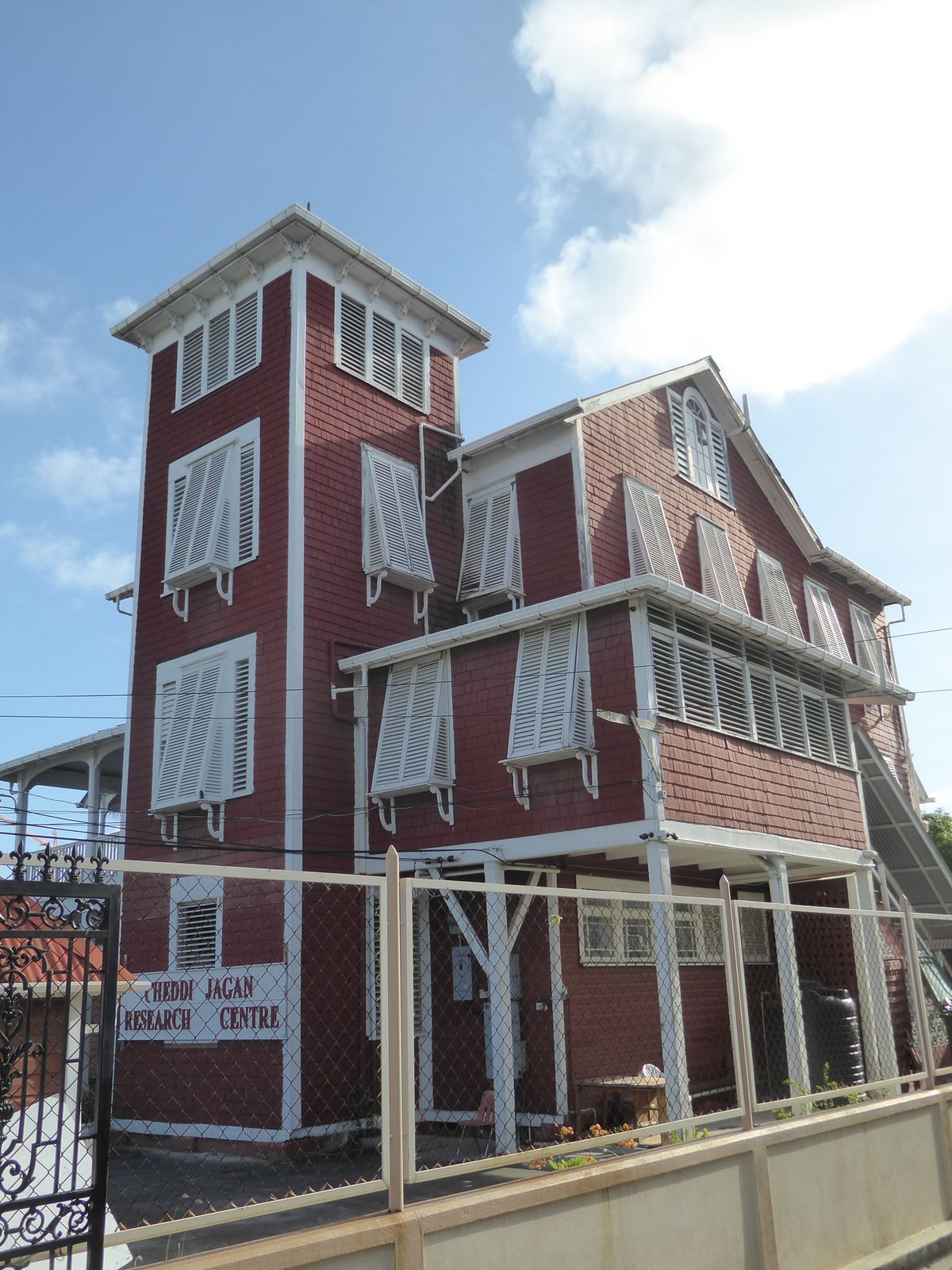 This, the so-called Red House, was the home of Eustace Woolford 1876-1966, one-time mayor of Georgetown and Speaker of the Assembly. The gov