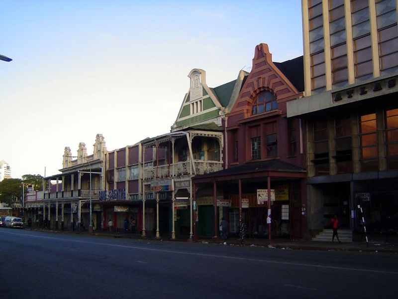 A lineup of the Arnold building and the twinned Store Brothers and Adams Building, the latter once a "gents outfitter."