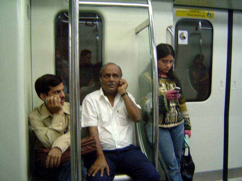 Three riders, three cellphones.