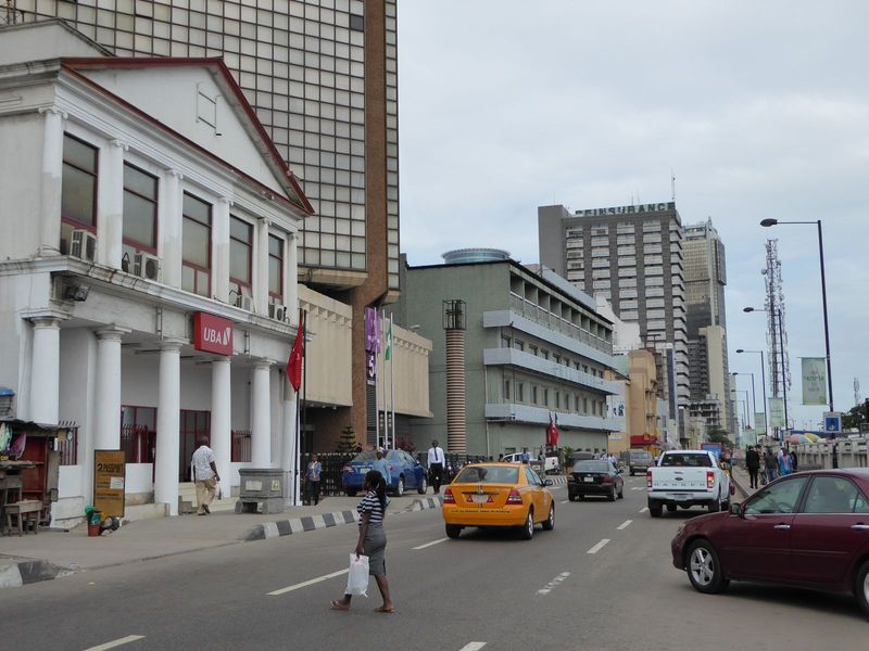 Streetside view of Marina on a day after somebody had died, leaving the markets closed and traffic light. UBA, the United Bank for Africa, i