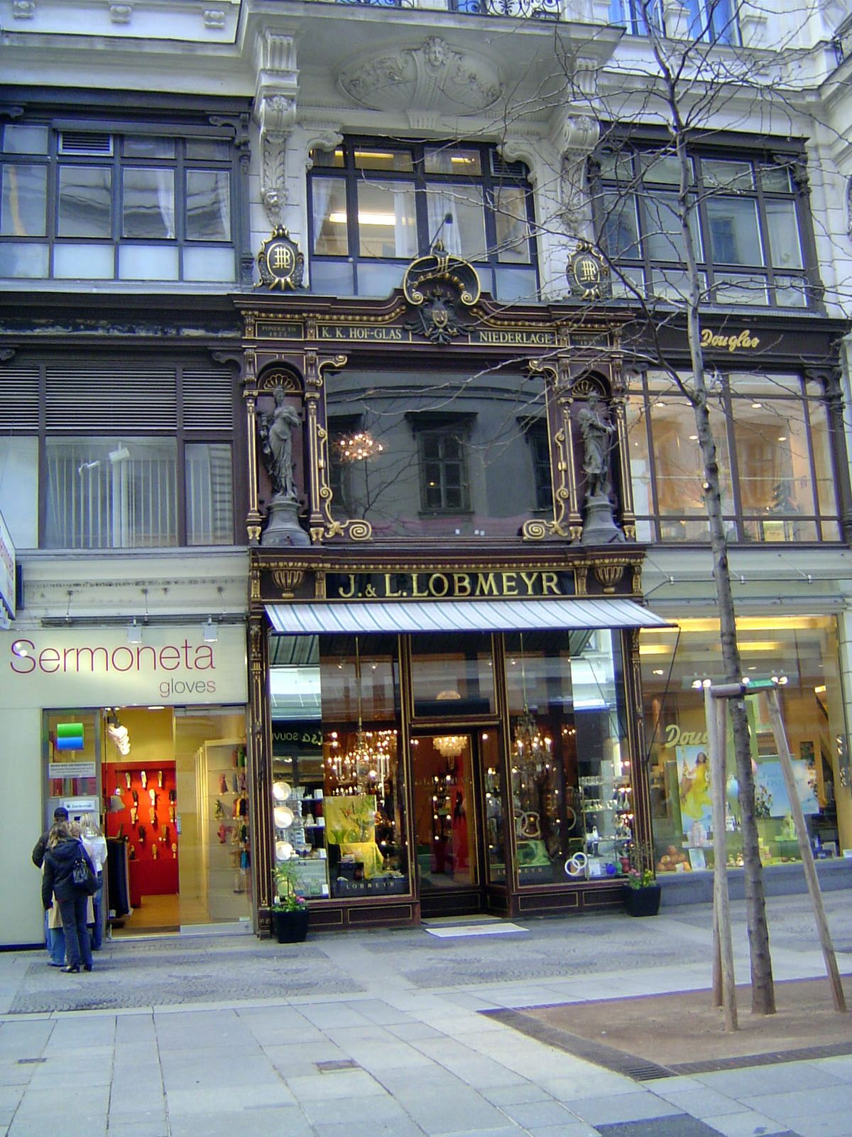 Quiet opulence on the front of a glassware store on the nearby Kohlmarkt.