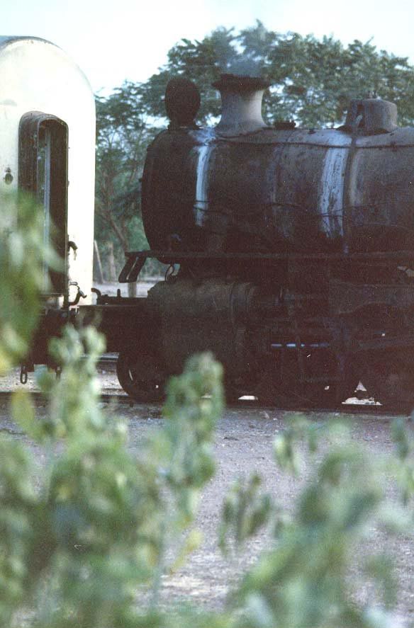 An old engine leaks steam at the Sennar yard.