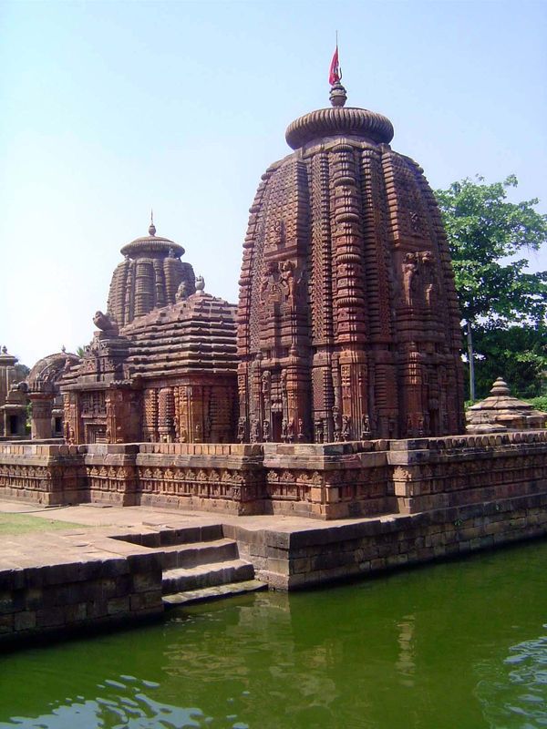 Behind the temple is this pool. Atop the tower is an urn, or kalasha, carrying the nectar of immortality, amrita. The grooved disc below the