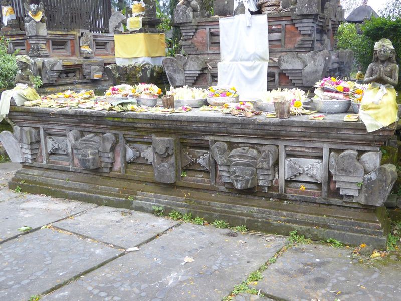 Ritual complete, offerings are left behind. The yellow wrapping signifies a holy presence.