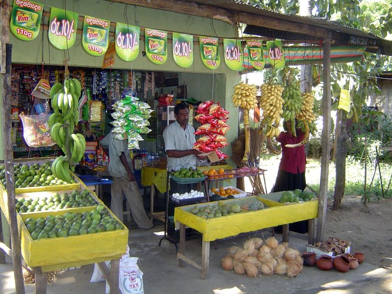Up the road, at Tambuttega, this merchant has apples from China. That's a testament to modern logistics and rising incomes.