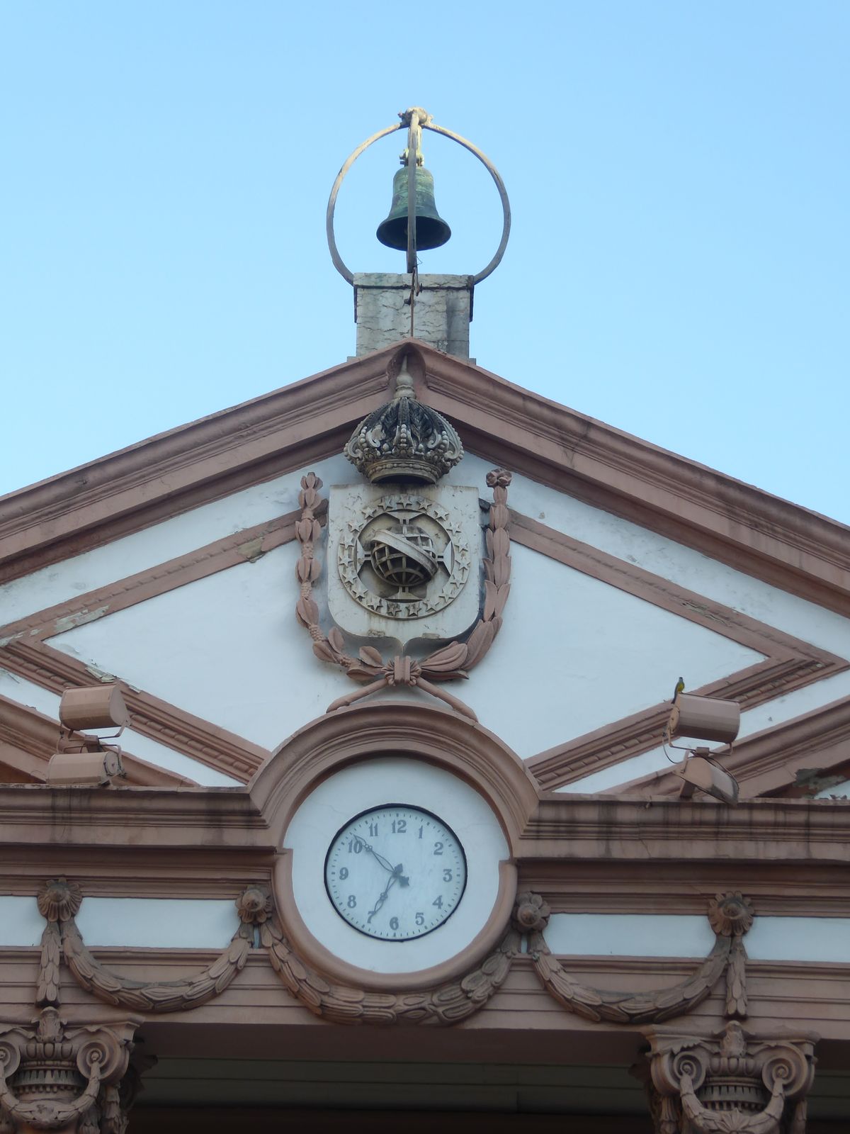 The coat of arms belongs to imperial Brazil and so appears to be at least a slightly later addition. Ditto, on general principles, the clock