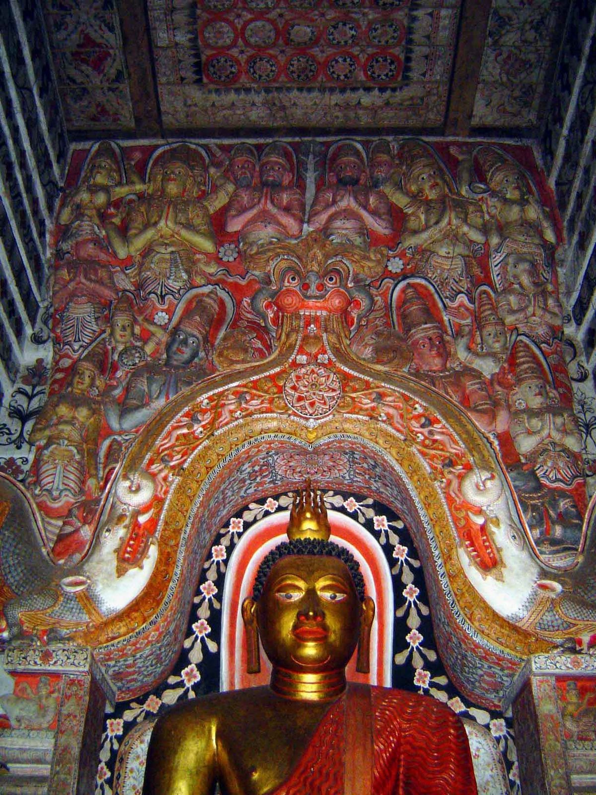 Above the arch of the pair of makaras, the gods of the Hindu pantheon are seen adoring the Buddha. Immediately above the arch, and on either