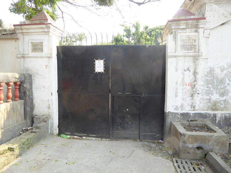 Can you believe it? The gate's locked and nobody answers, but lo!, the little door opens.