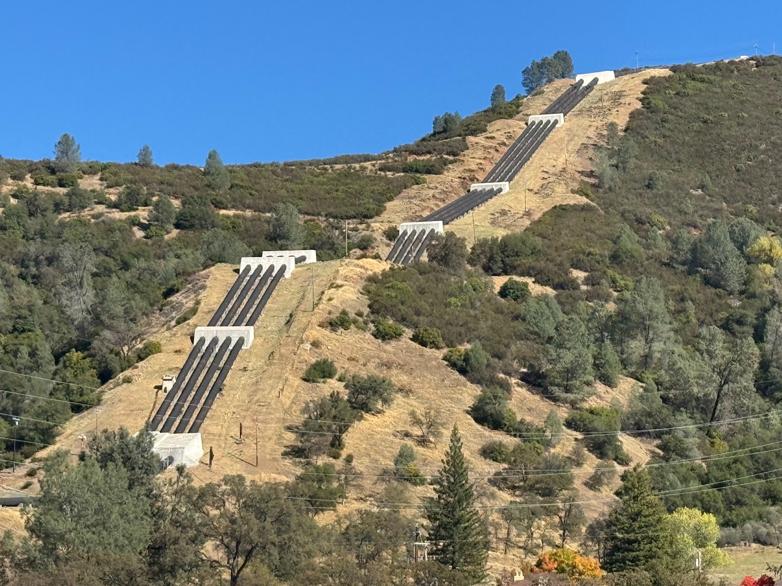 Ten miles farther up the highway, these are the penstocks for the Moccasin powerhouse, part of the Hetch Hetchy system, which brings water f