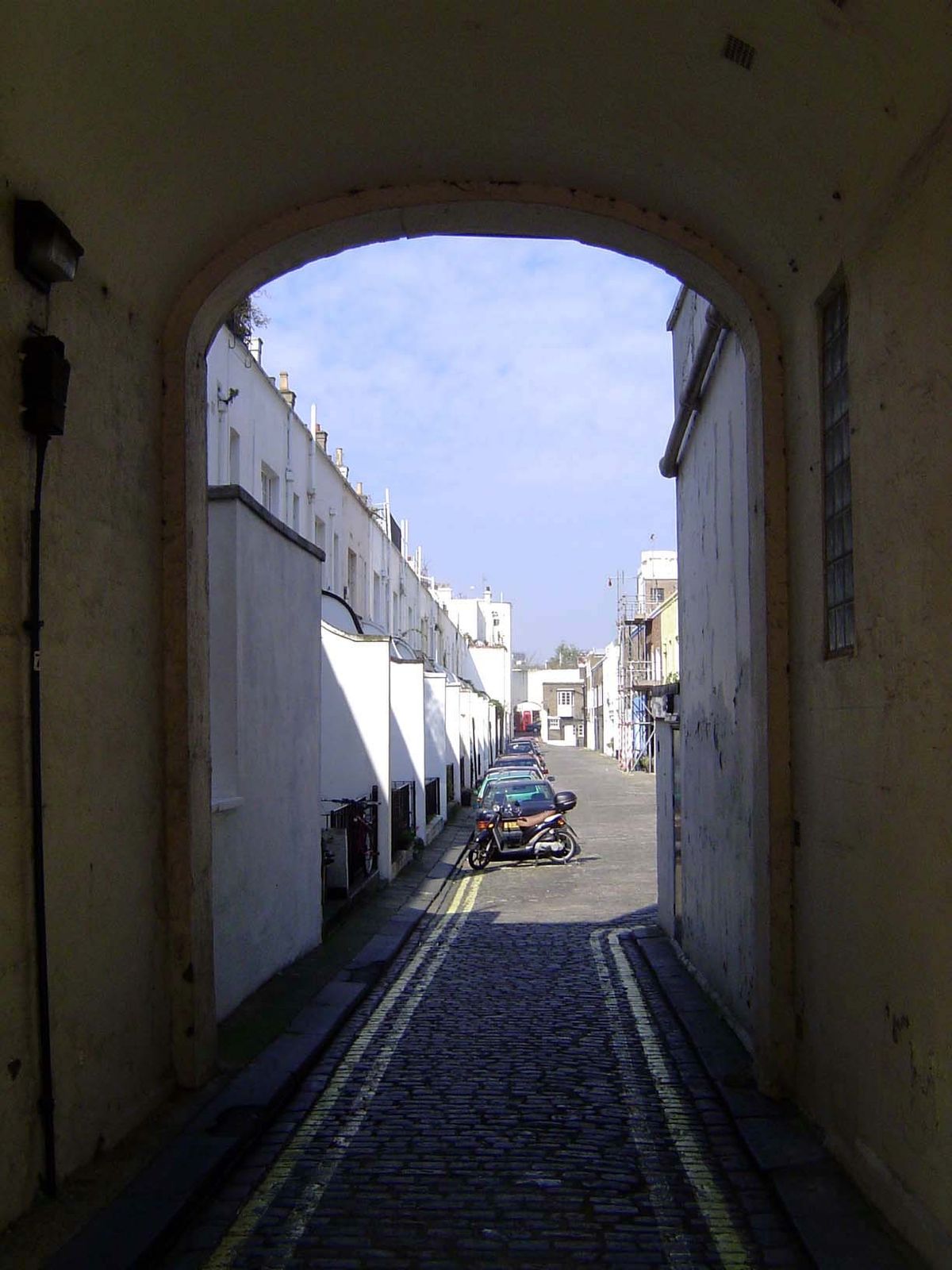 Behind the houses a tunnel leads to the mews.