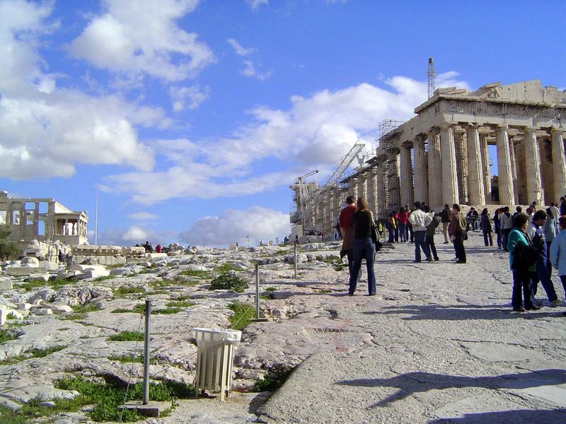 Parthenon on the right and Erechtheion on the left. The space between was once crowded with monuments, including a giant statue of Athena. T