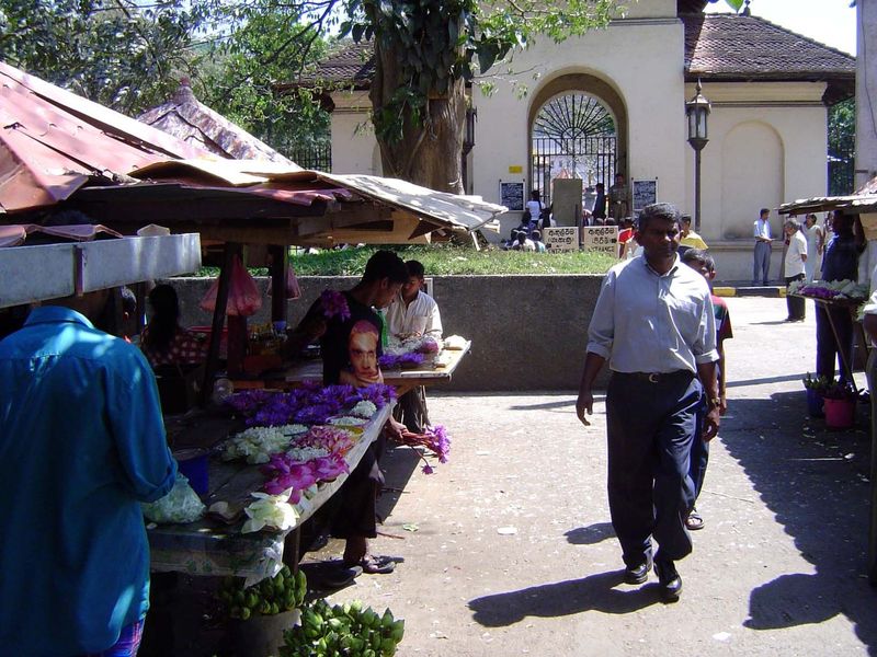 Gate into the Temple of the Tooth, the Dalada Malagawa literally, the "Tooth Palace." At the entrance, flowers are regularly for sale as tem