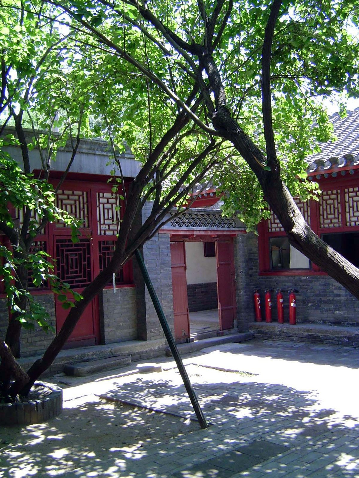 We've gone through that second door, crossed the courtyard, and turned around to look back. Keep your eye on the fire extinguishers.