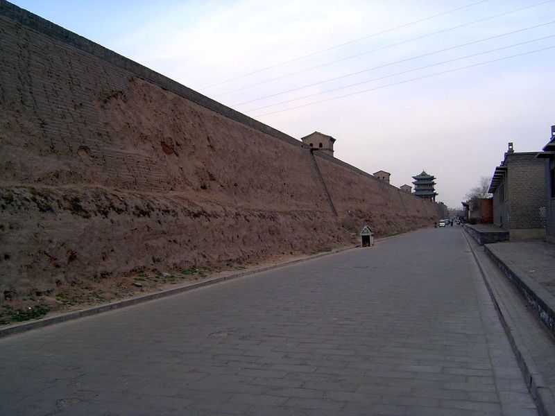 The unfaced inside surface of the wall, here on the north side, reveals the wall's earth core.