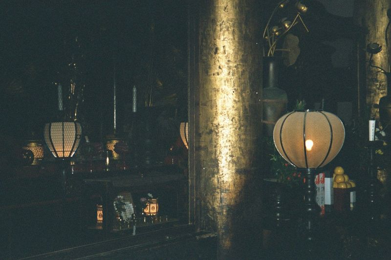 The interior of the temple is seriously dark, despite being open on the porch side and lit by many lamps.