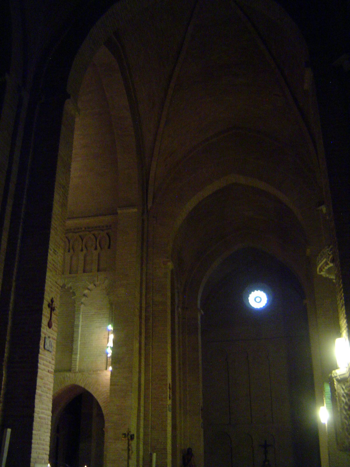 Anticipating the Gothic in yet another way, the church has a transept and a vaulted masonry roof over the crossing.