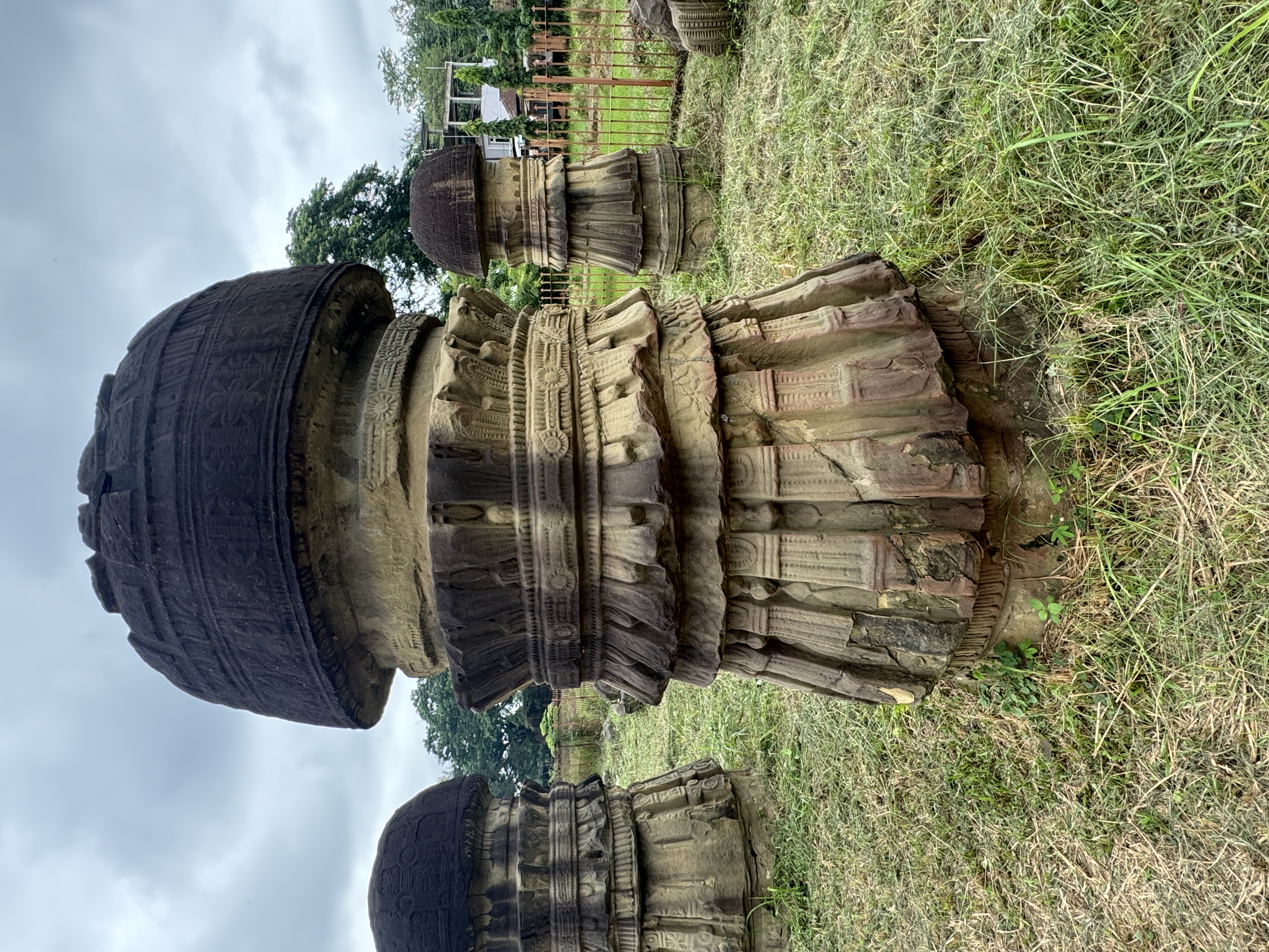 "No two are precisely alike in the minor ornamentation, but all are of one general form, large semi-circular tops with concentric foliated c