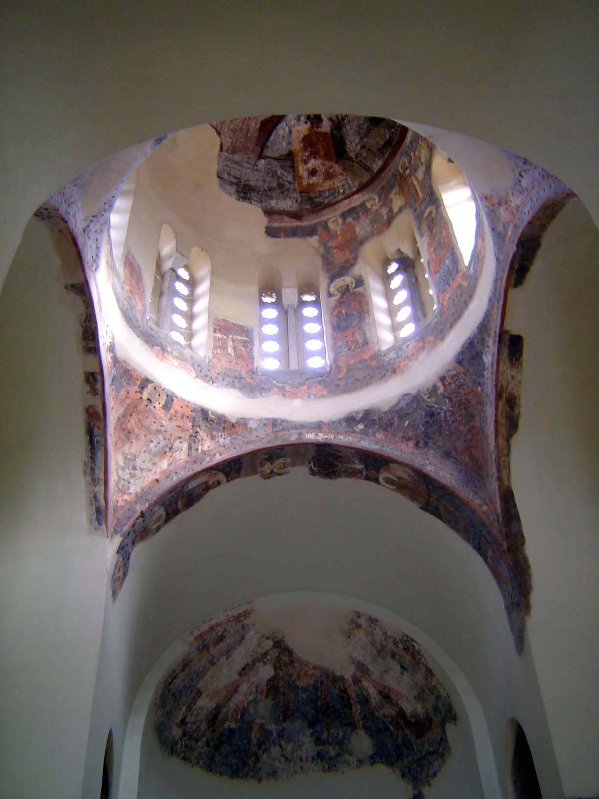 The floor plan is unusual, with a cross in a square.