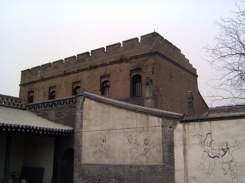 An exception to the rule: this unusual, European-styled building housed the Chinese Armed Escort Agency. Hence the murals surrounding the co
