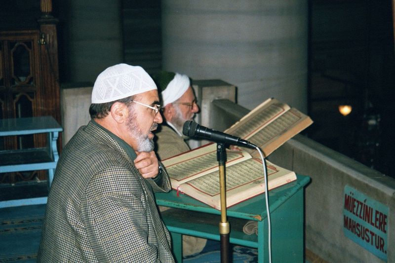 An imam chants next to the Sacred Safekeeping Rooms, which adjoin the harem on the northeast and where relics of the prophet are kept.