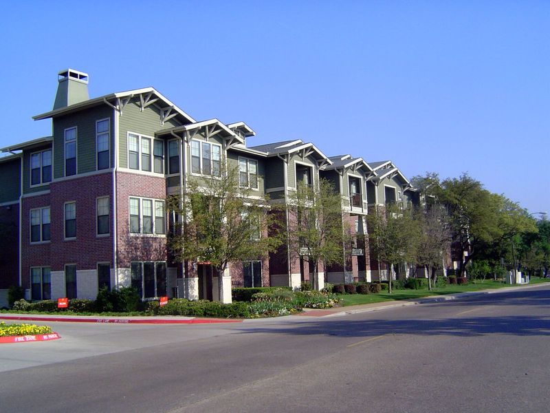Here's the newer stuff, which rises three floors instead of two and so packs more units on an acre.