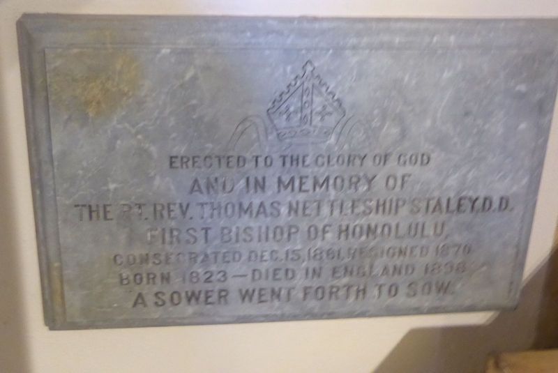 This plaque is on the chancel ambulatory. Bishop Staley was a Cambridge graduate from 1844. Following his appointment as principal of the Co