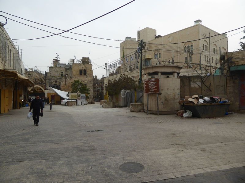 Looking eastward, this is the entrance to the qanatir or arches, the local name for the Old City. The signs are a reminder that this neighbo