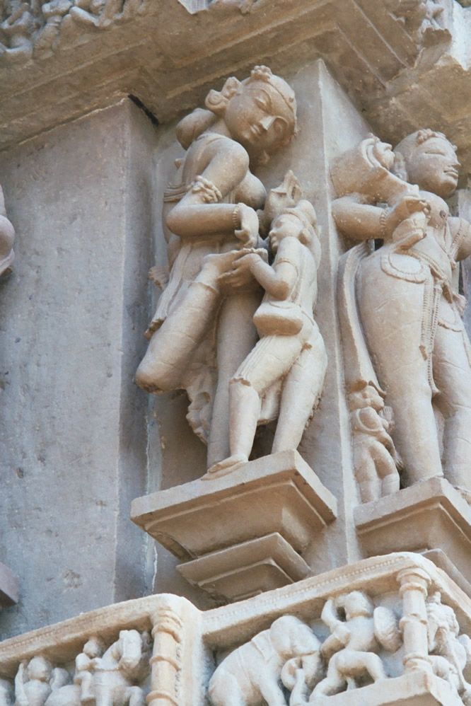 Lakshmana has the most completely sculpted surface of any of the temples. Here, the common motif of a thorn being removed from a foot.