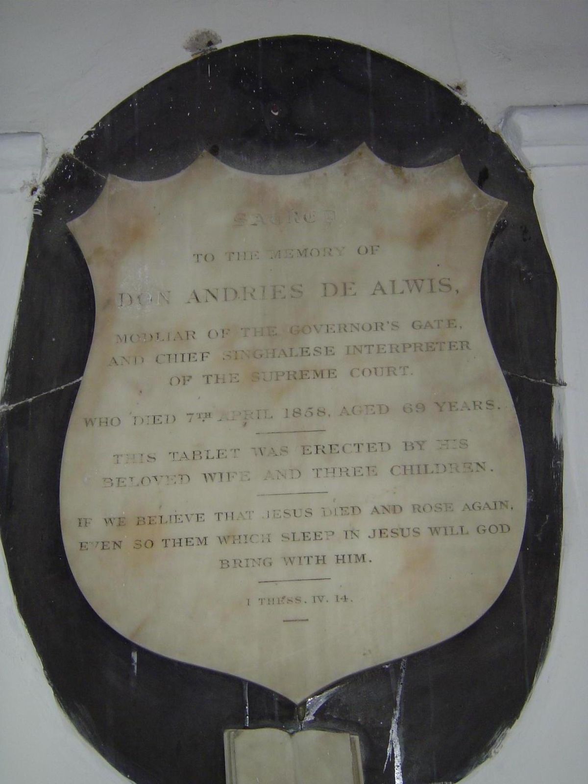 On the church wall, a memorial to a court functionary, the chief Sinhala interpreter.