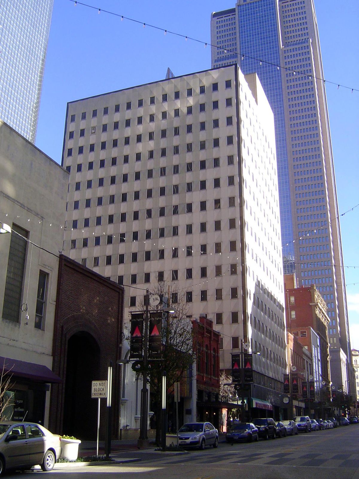 The city's first skyscraper, the Praetorian Building of 1910, hides under a skin applied in 1960.