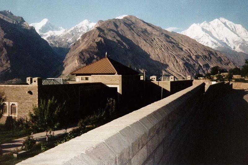 A school funded by the Aga Khan Foundation has sought a compromise. The building is constructed of blocks colored to match the hills beyond.