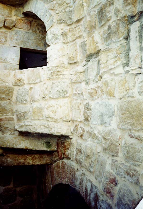 An opening for someone to chat with someone in the courtyard below.