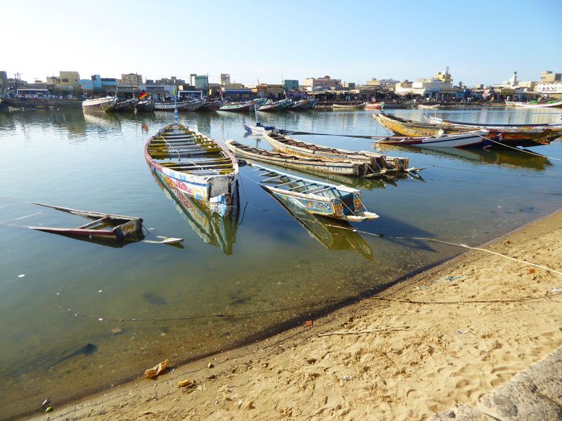 Pirogues of every size and condition are tied up along the Petit Bras, on the west side of the island. That's still Barbarie in the distance
