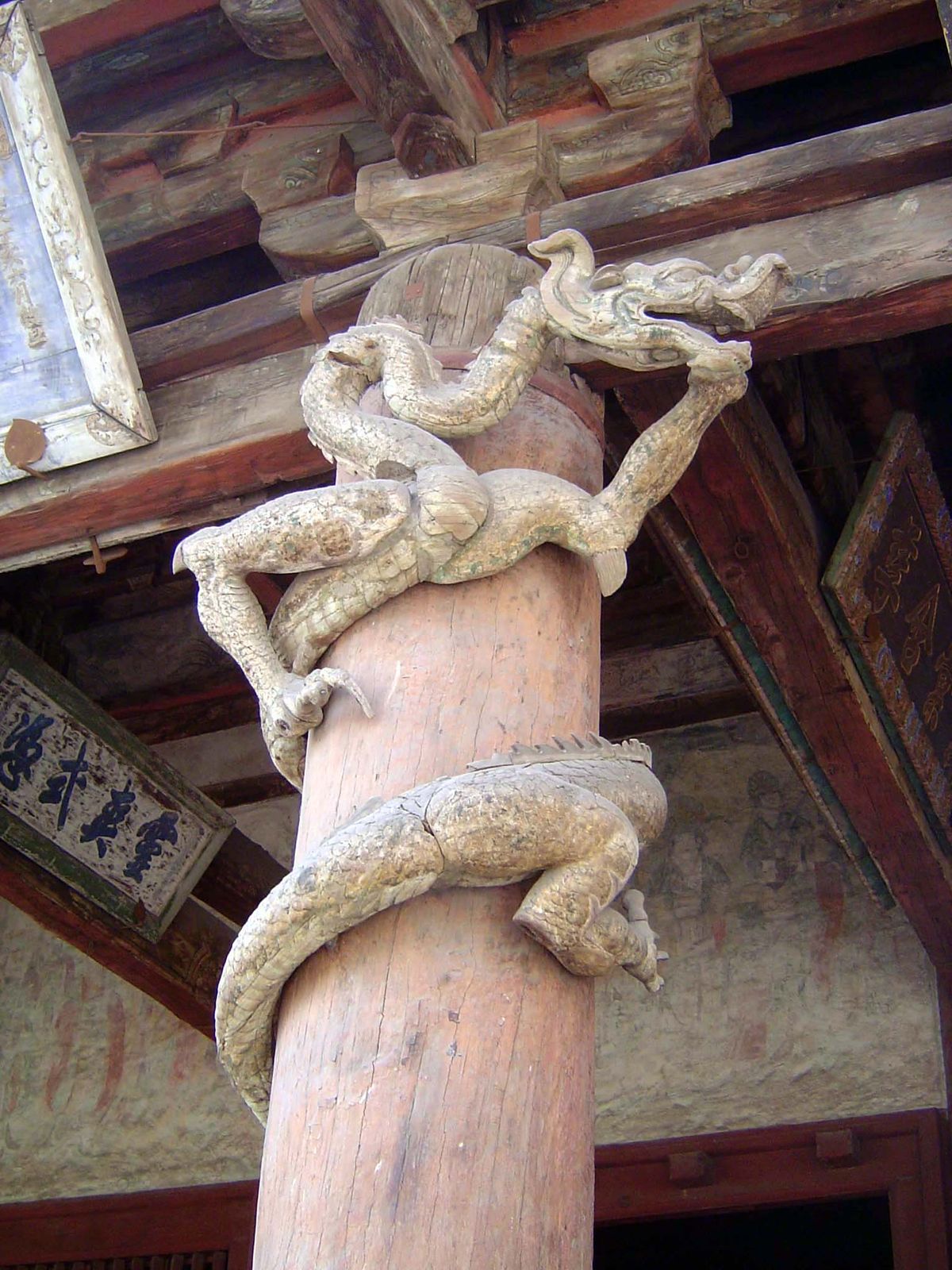 Dragons wrap the columns on the front side of the hall. They, too, were intended to help bring rain, and they suggested as well the power of