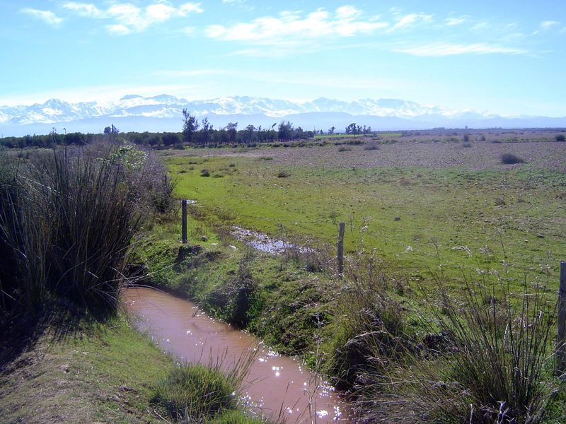 The city occupies a small part of the Houaz, a plain rimming the northern side of the High Atlas, shown here with January snows.