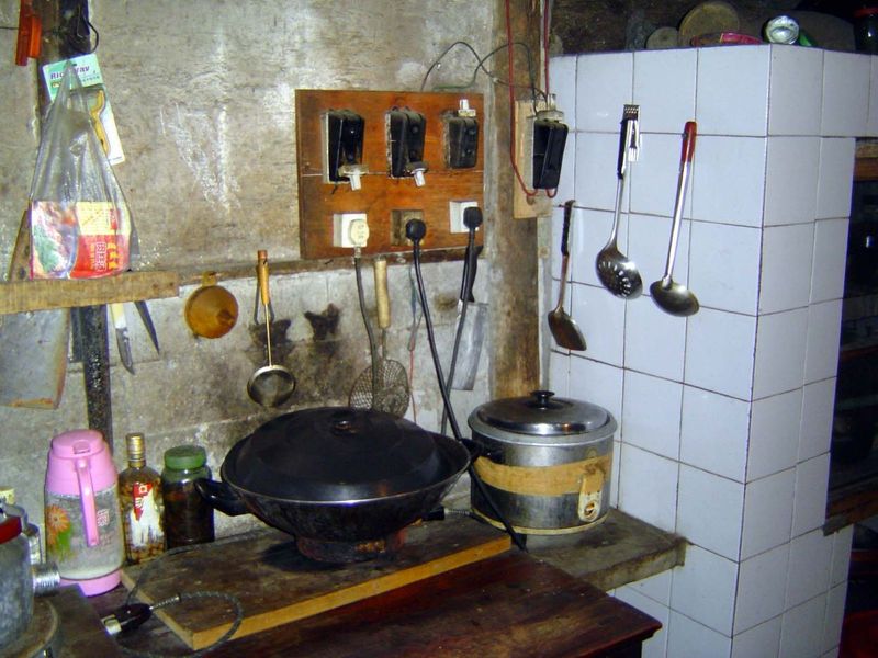 Inside, a tiled and immaculate kitchen with electric cookers.