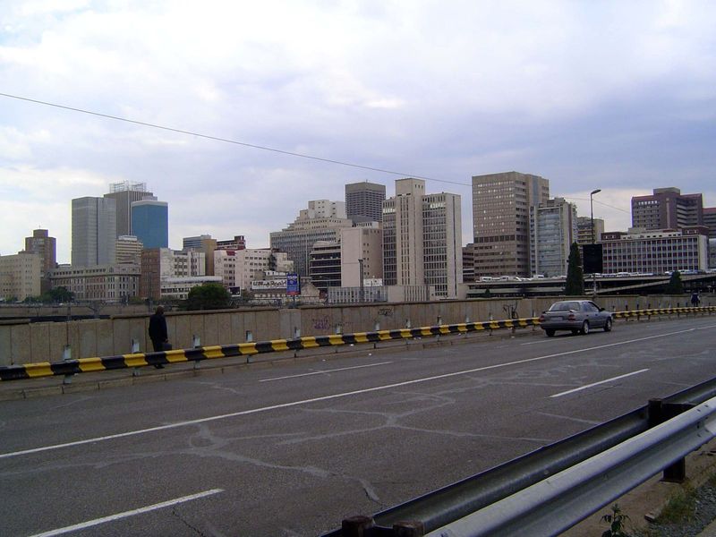 The view of the CBD from the none-too-regal Queen Elizabeth Drive as it passes over a wide set of railroad tracks.