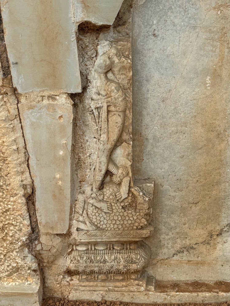 Here she is.  There are a few other comparable images around the stupa.