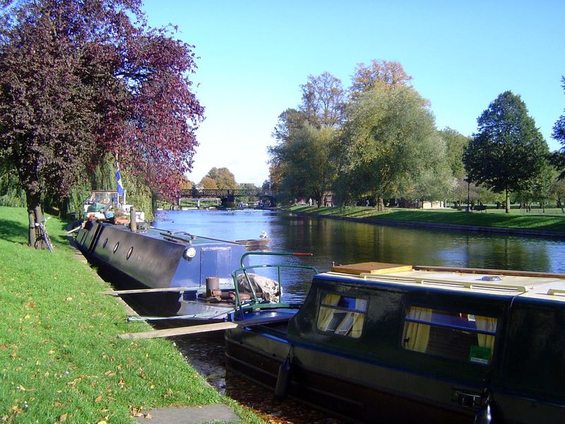 Downstream, the river curves east and widens here above the Jesus Lock; Jesus College is off to the right.